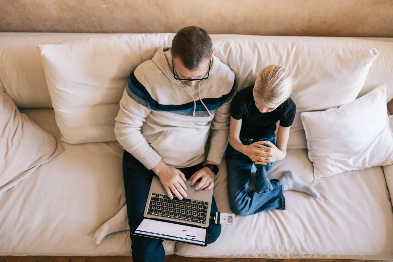 Father and daughter on the computer