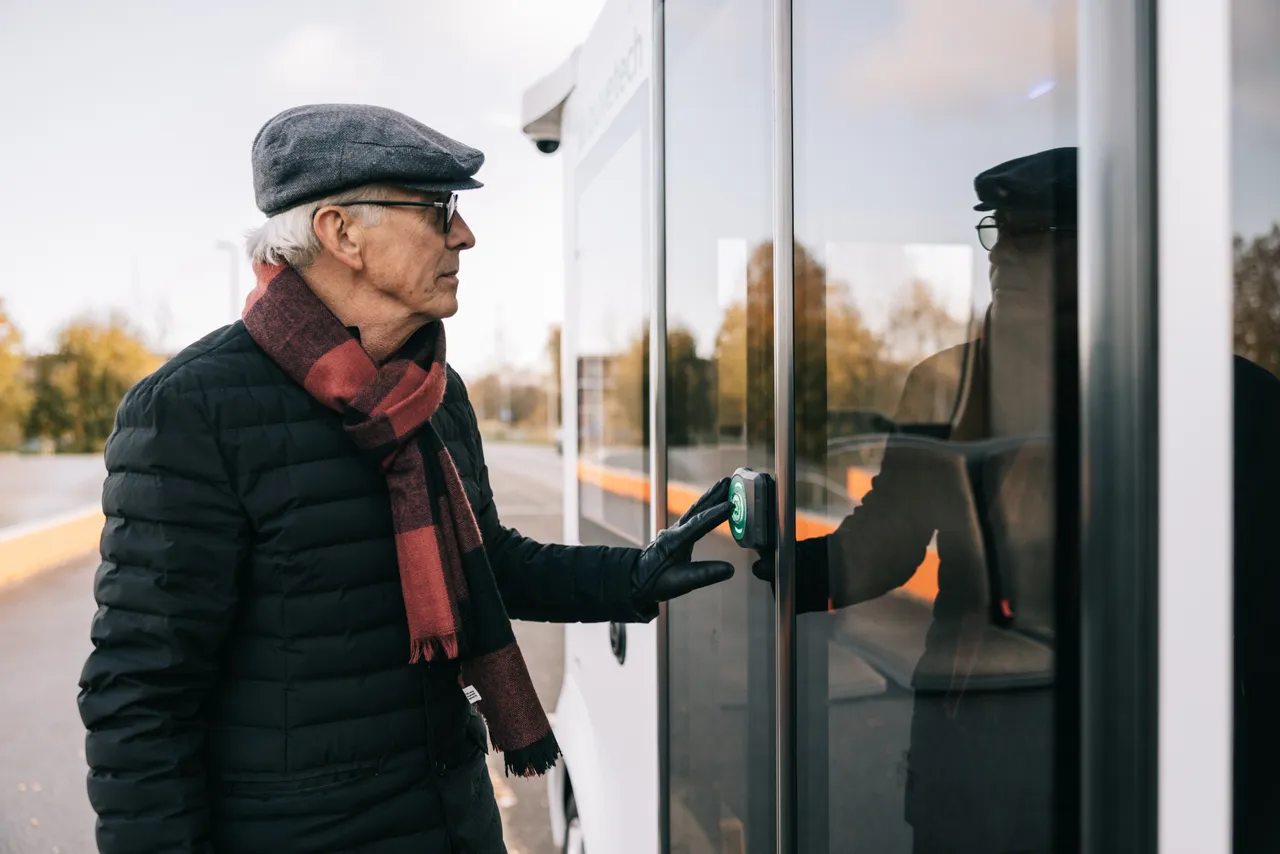 Man entering a self-driving bus