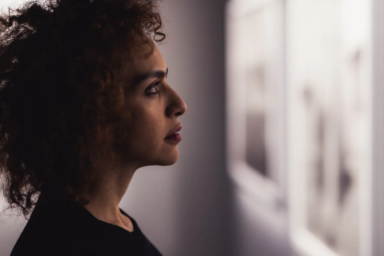 Woman looking at art