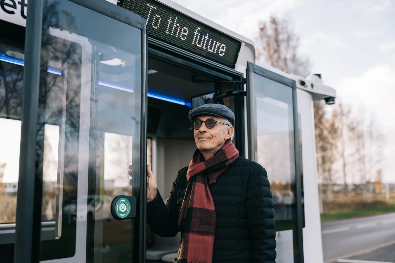 Man boarding a self-driving bus