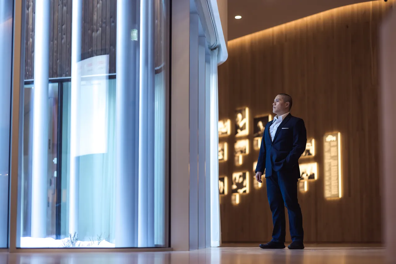 Man standing in modern wooden interior
