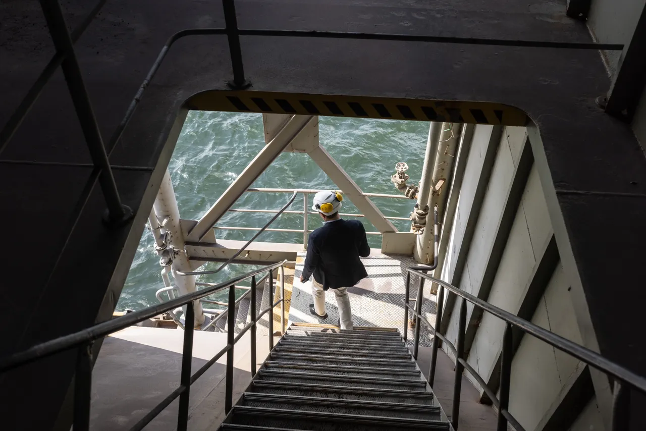 Man inspecting ship components