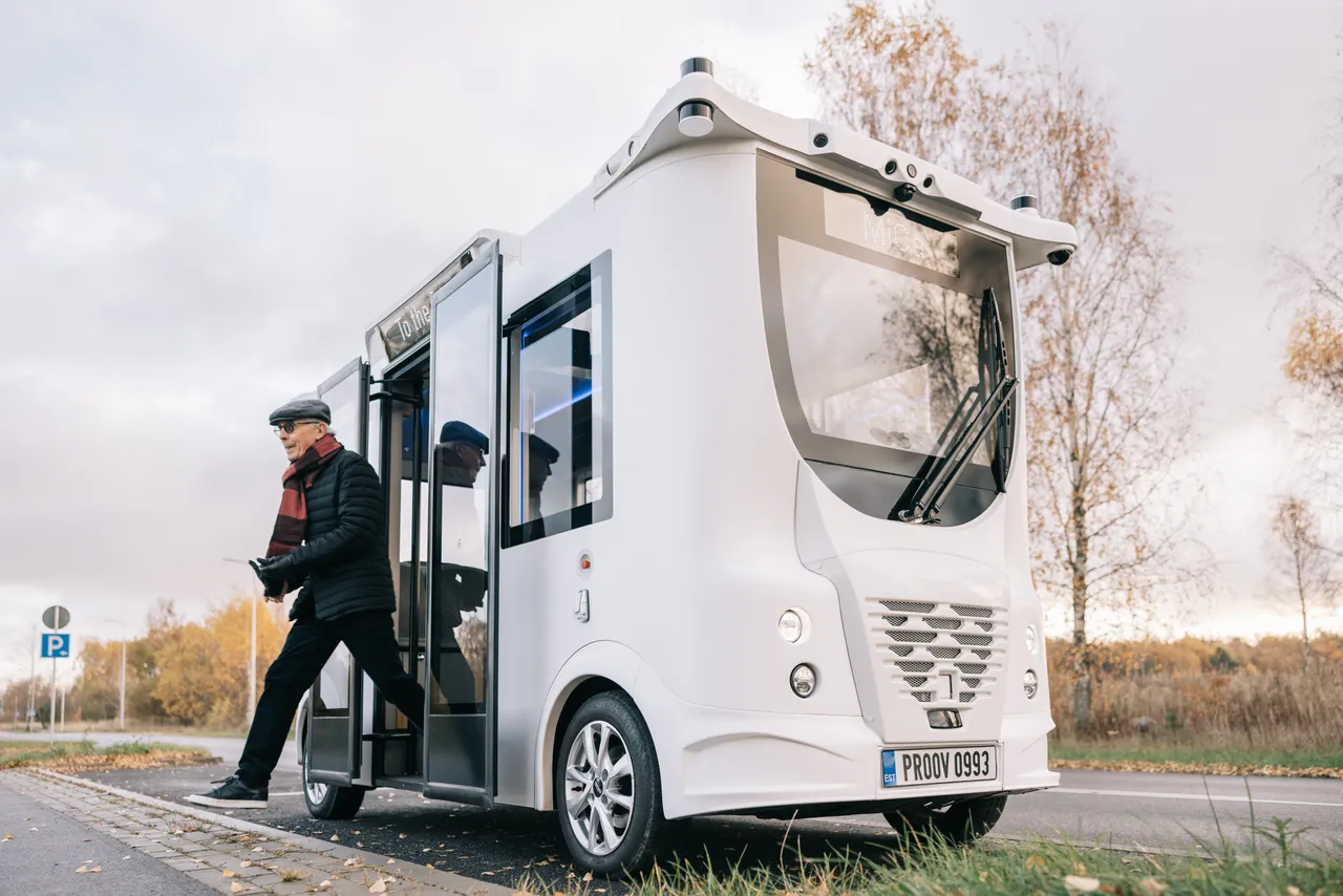 Man exiting a self-driving bus