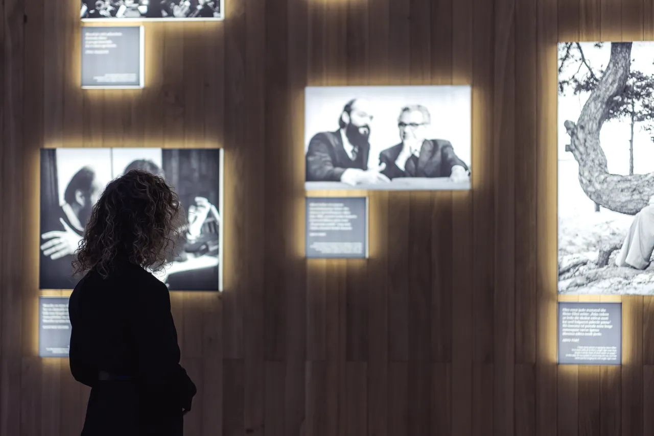 Woman looking at photo exhibition