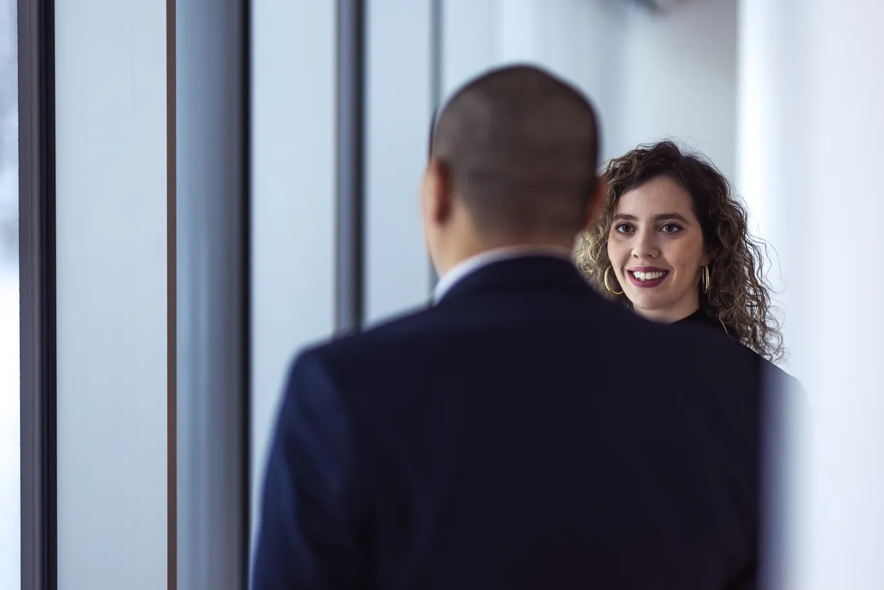  Man and woman talking by the window