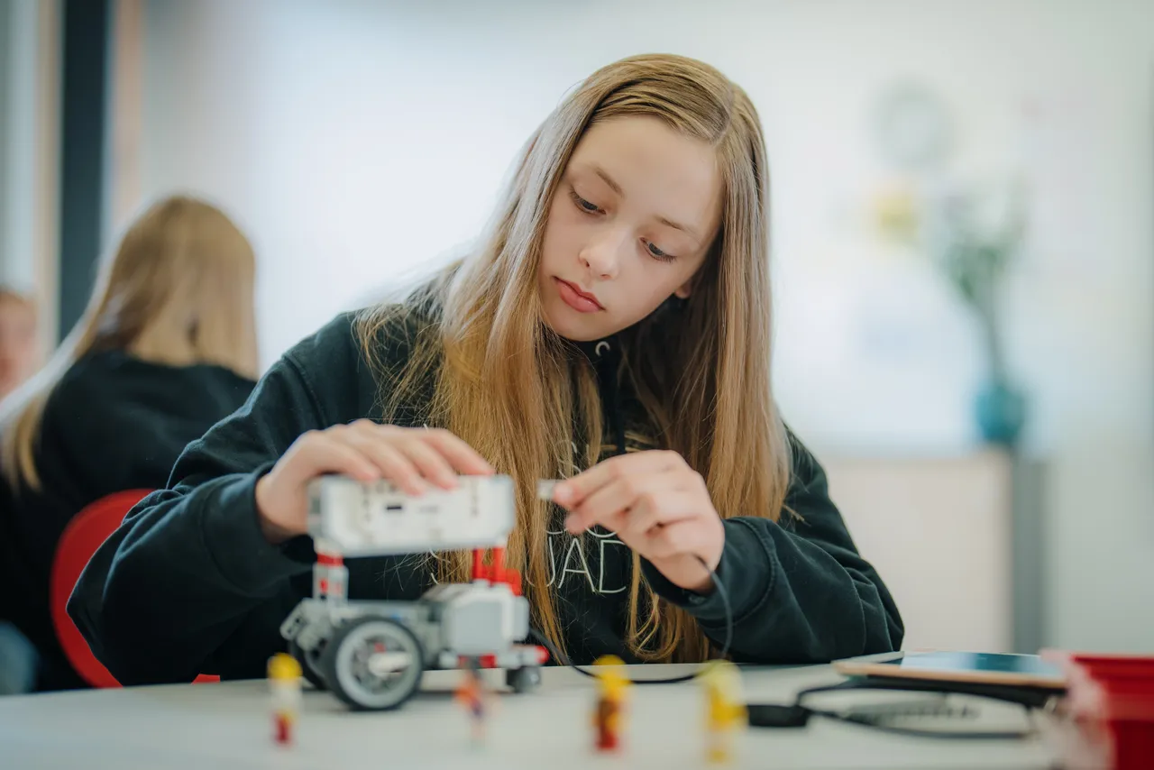 Child building a robot