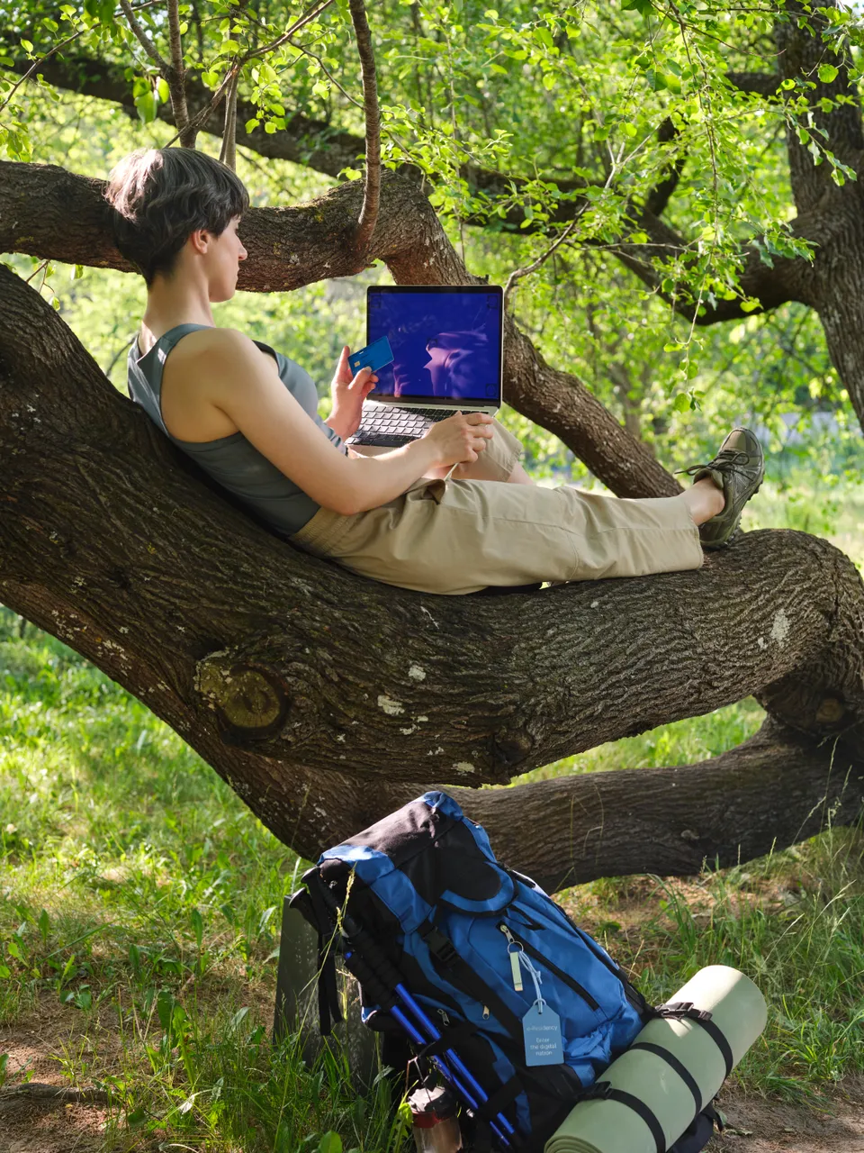 Woman with laptop in nature