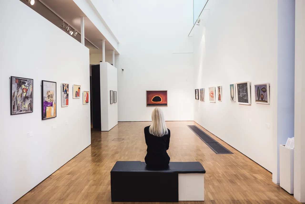 Woman looking at painting