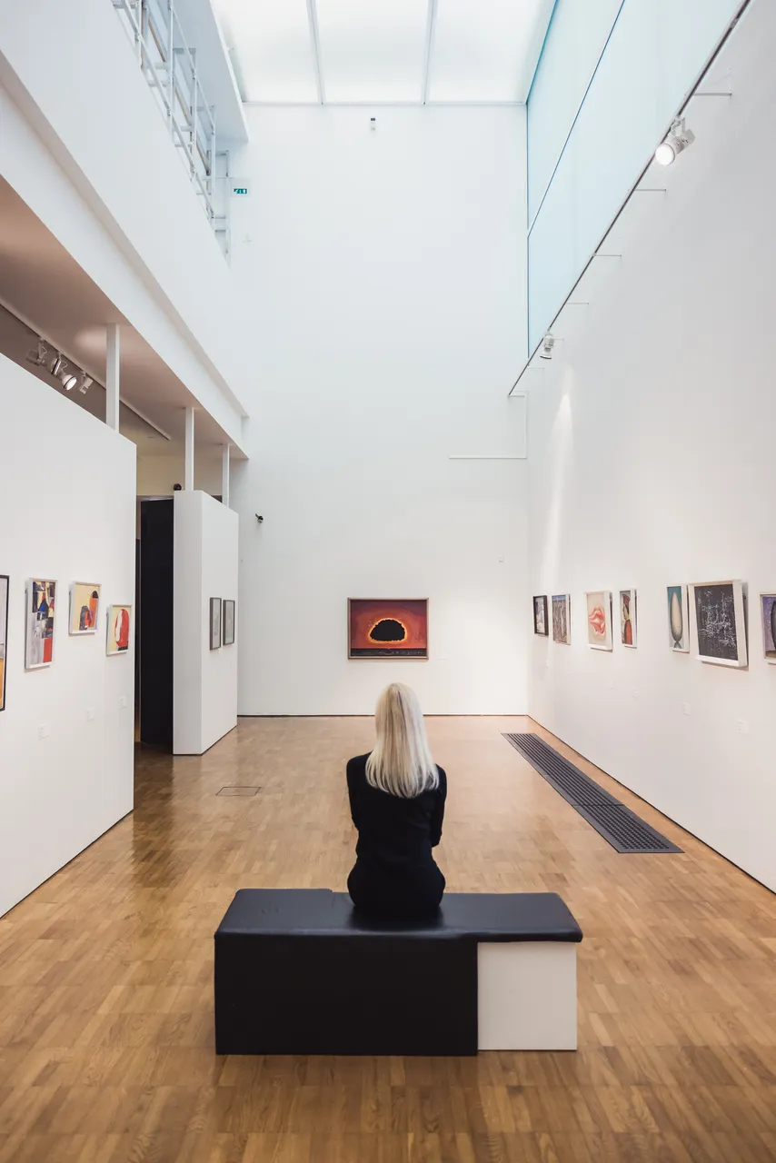Woman looking at painting