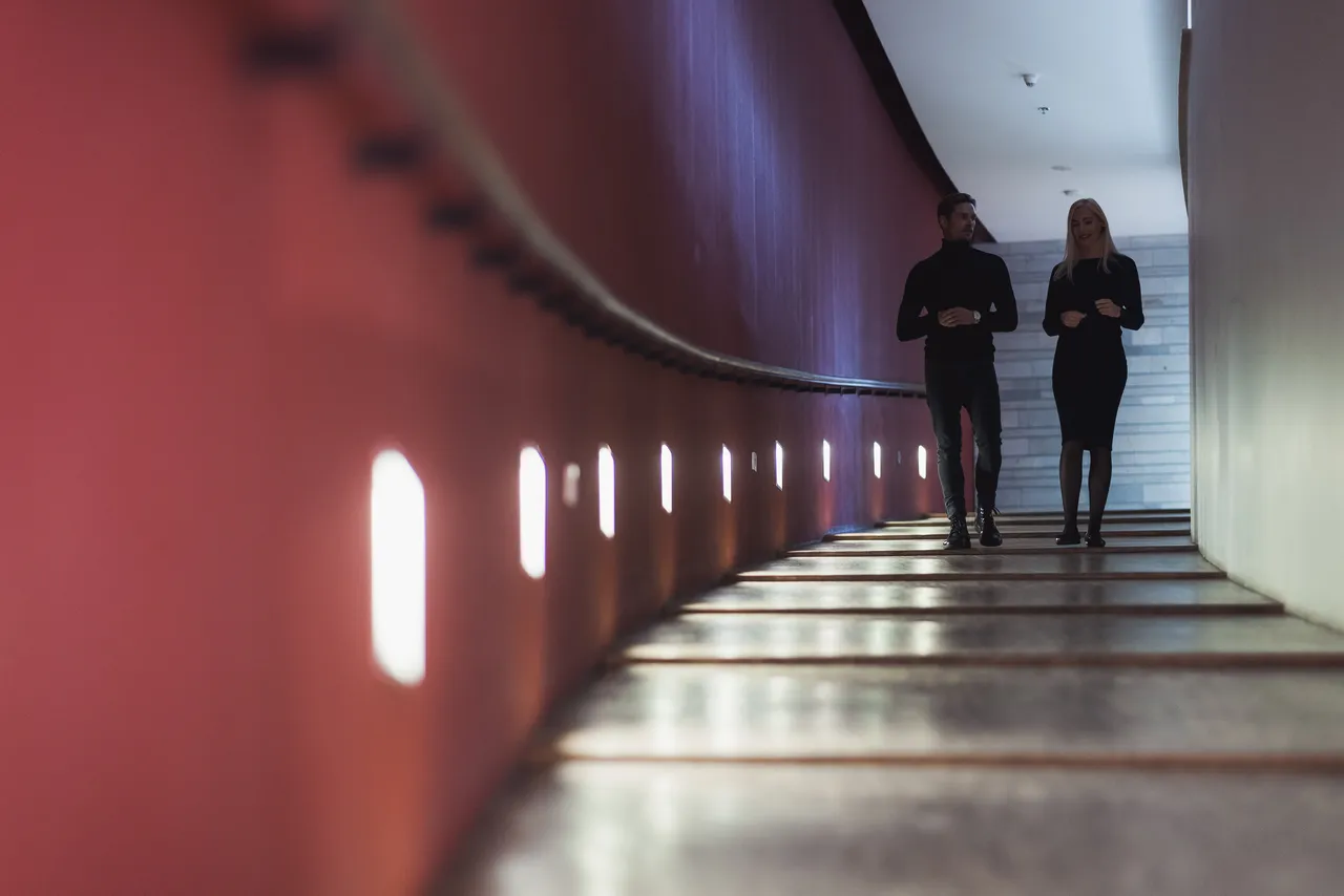 Couple walking in corridor