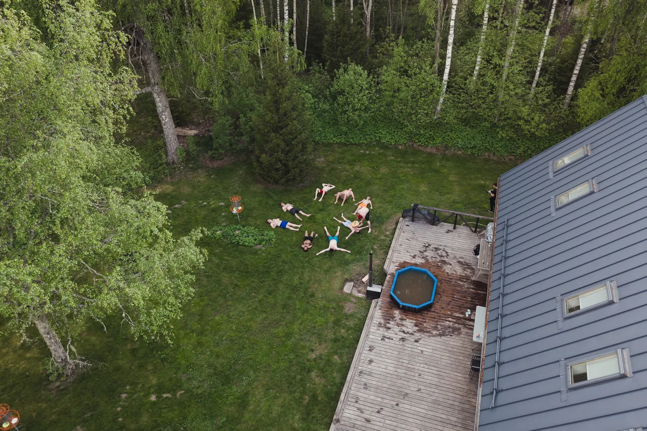 Men enjoying barrel sauna