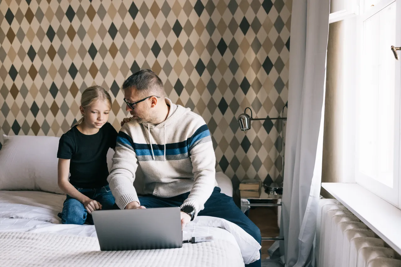 Father and daughter on the computer
