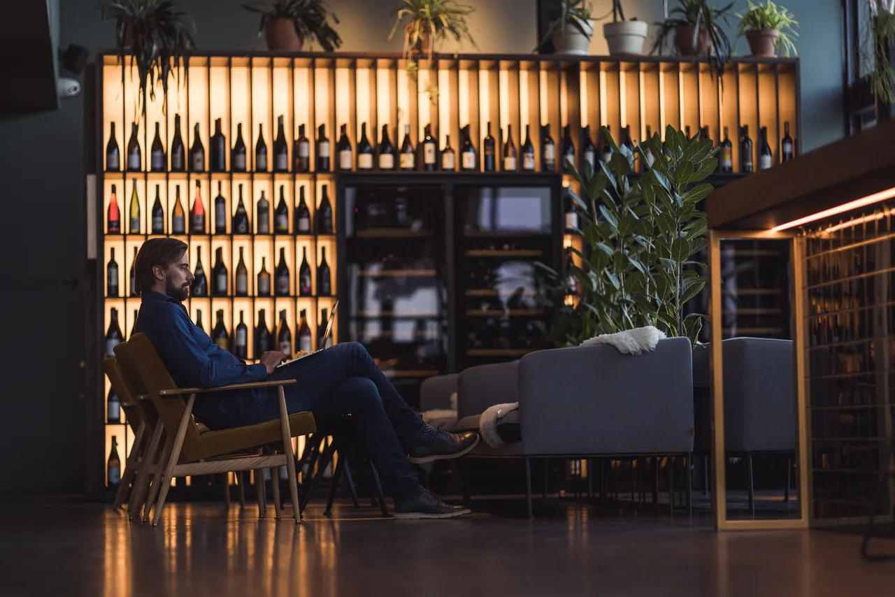 Man in lounge with laptop