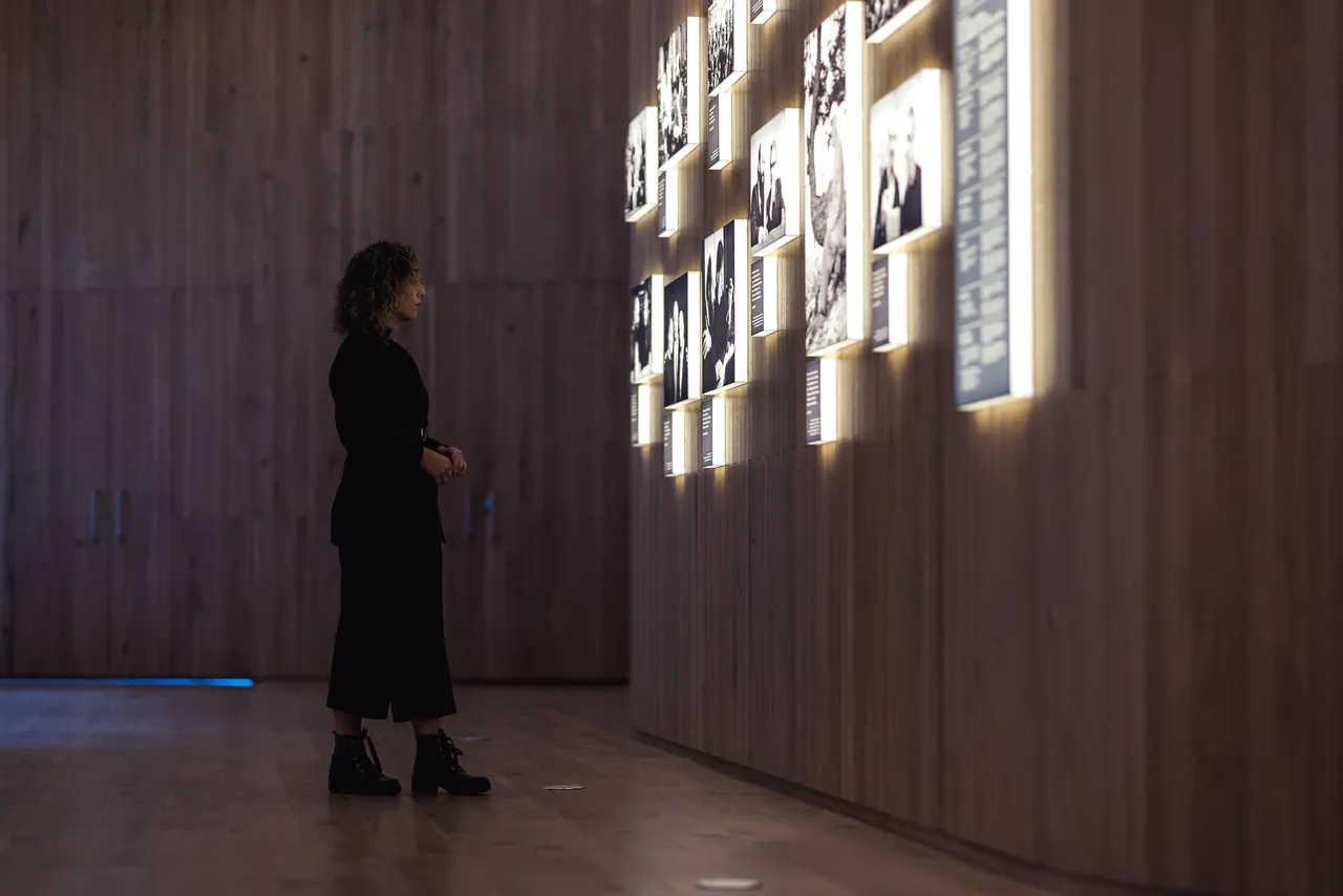  Woman reading biographical display