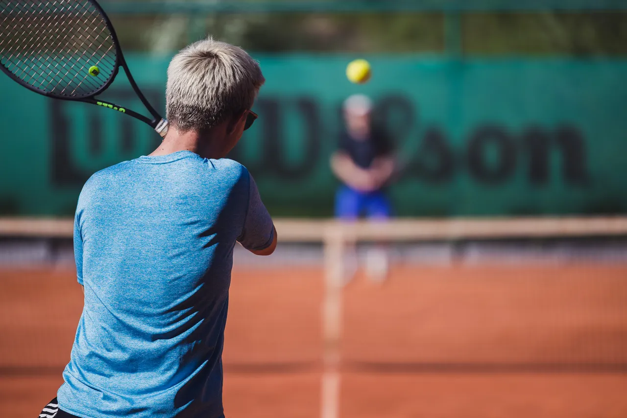Men playing tennis