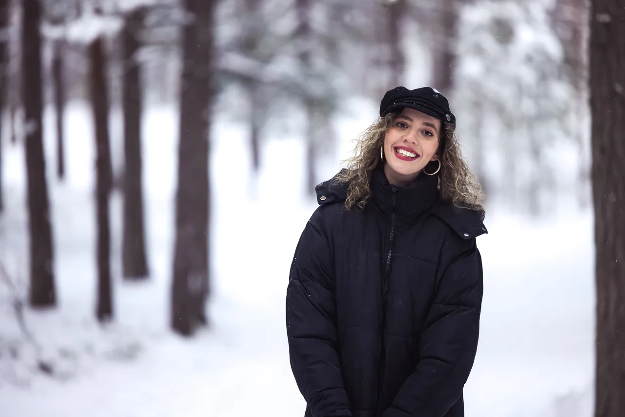 Woman in snowy forest