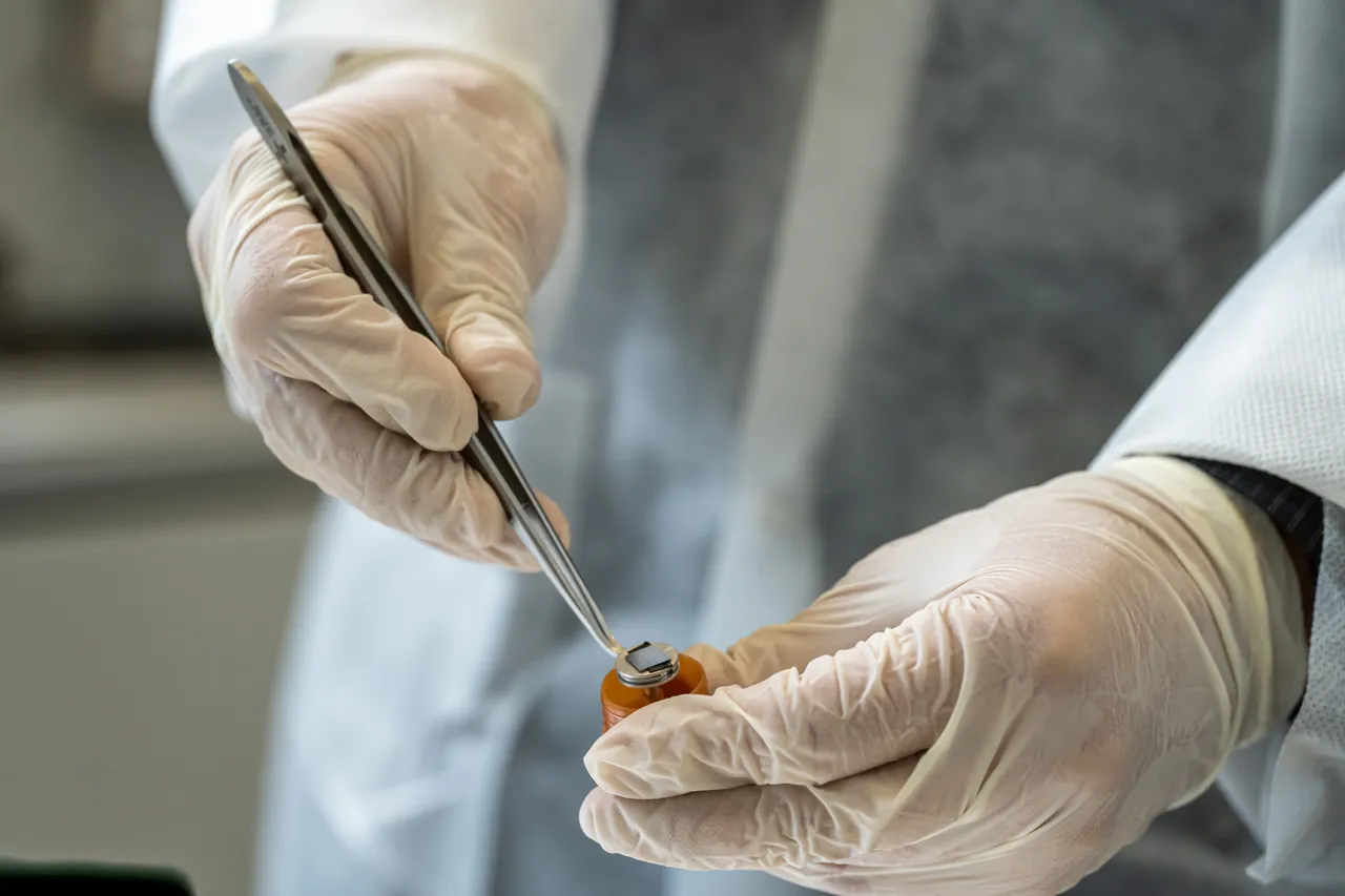 Scientist holding container
