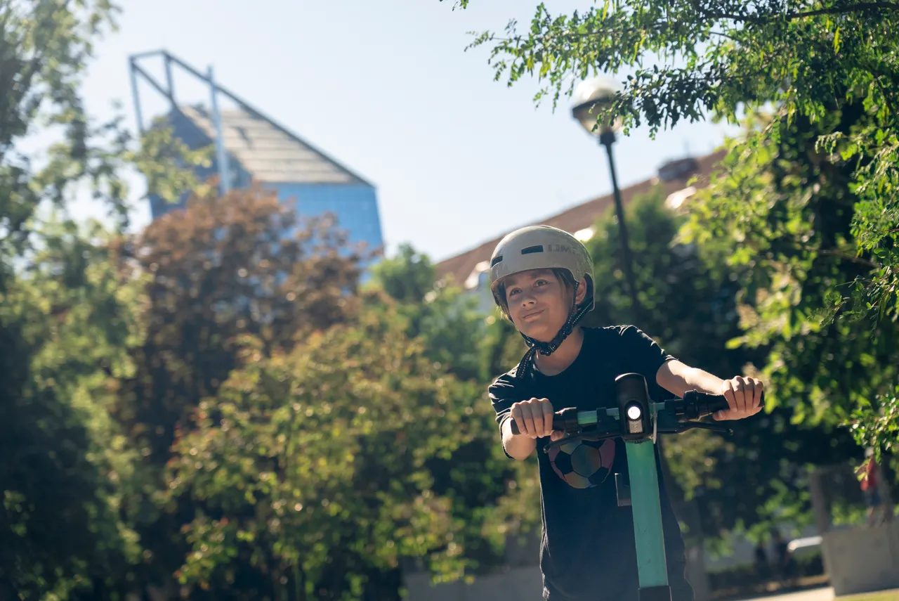 Young rider on scooter