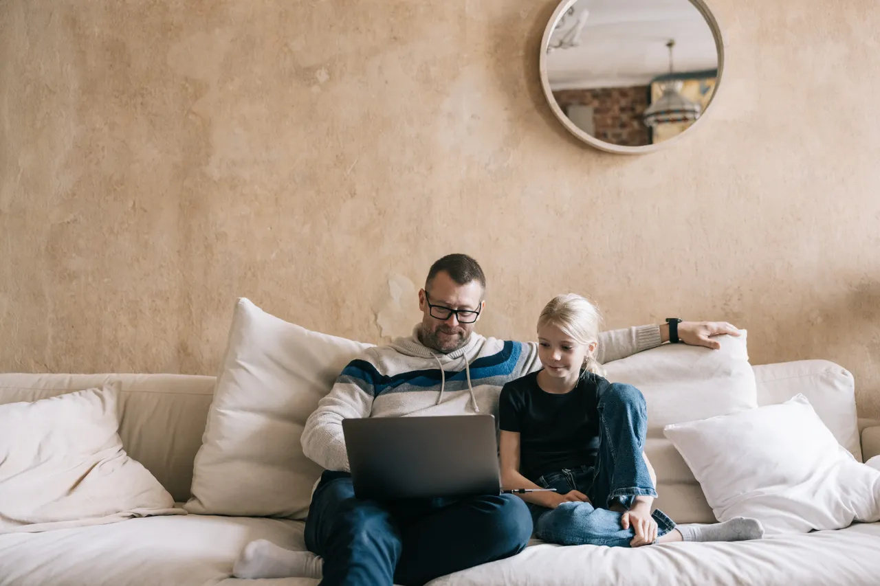 Father and daughter on the computer
