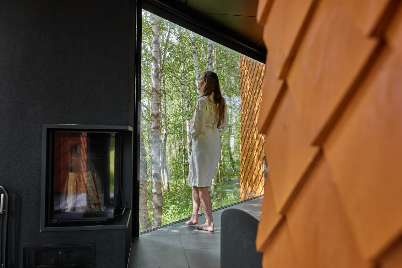Woman enjoying nature view from window