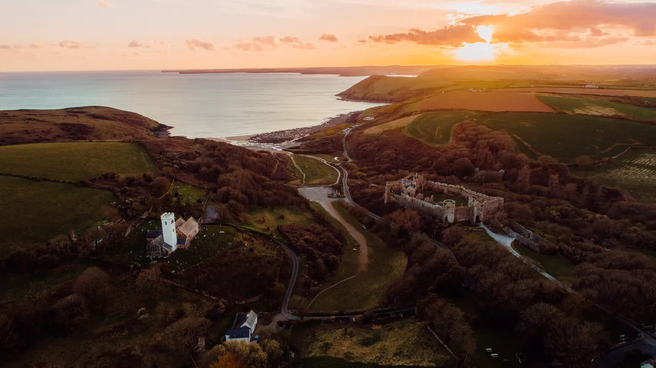 Manorbier Castle and beach at sunset