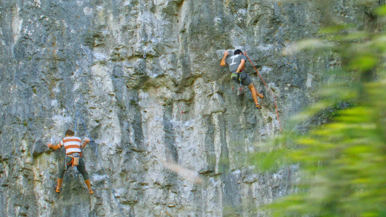 climbers hang from Kilnsey crag ©Project Yorkshire 2022